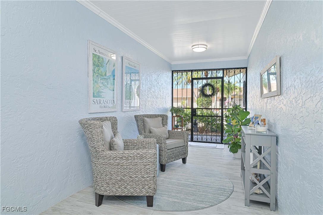5590 Buring Court Fort Myers, FL 33919 - Photo 6 of 38 a living room with furniture and a floor to ceiling window