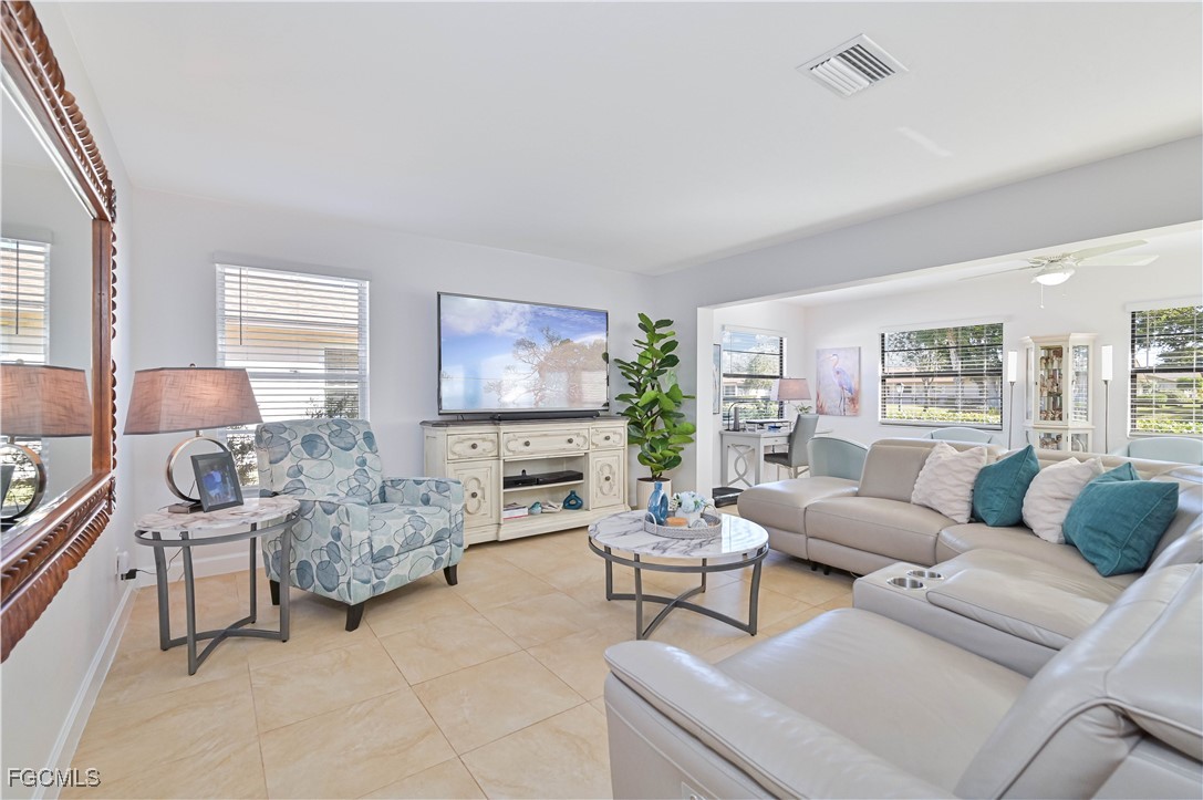 5590 Buring Court Fort Myers, FL 33919 - Photo 10 of 38 a living room with furniture and a flat screen tv