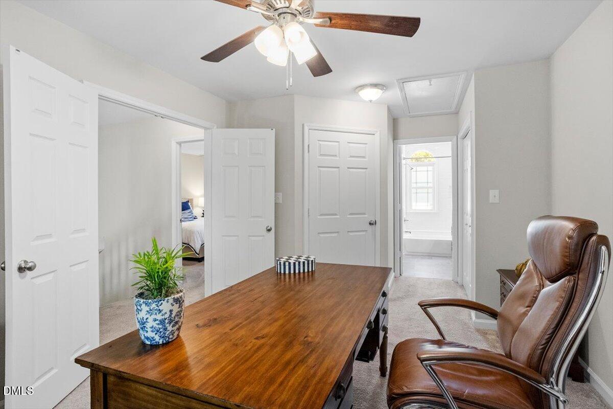 8321 Hempshire Place, Unit 103 Raleigh, NC 27613 - Photo 15 of 25 a room with furniture and wooden floor