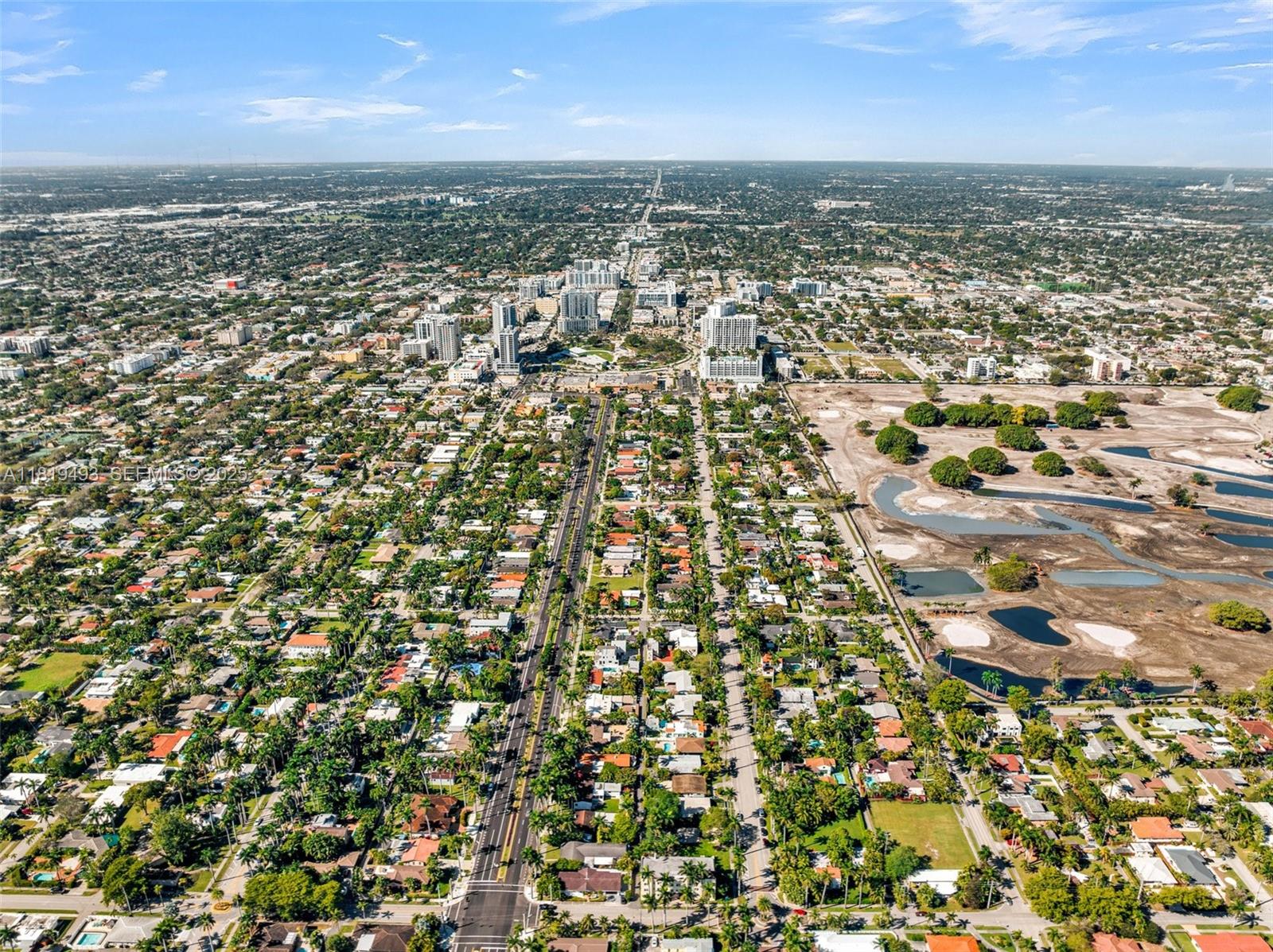 1310 Polk Street Hollywood, FL 33019 - Photo 25 of 31 an aerial view of residential building and parking space