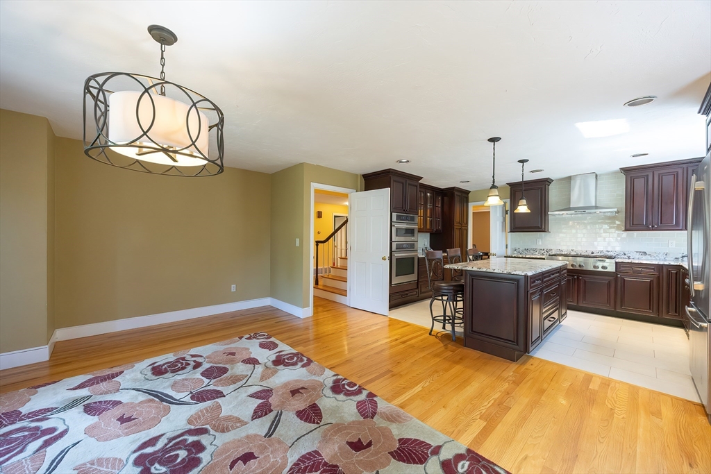 290 Central Avenue Milton, MA 02186 - Photo 12 of 40 a kitchen with stainless steel appliances granite countertop a sink dishwasher stove top oven and cabinets