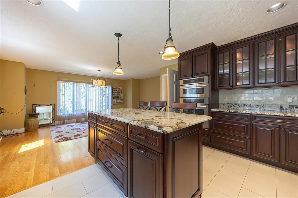 290 Central Avenue Milton, MA 02186 - Photo 13 of 40 a kitchen with a stove and a sink
