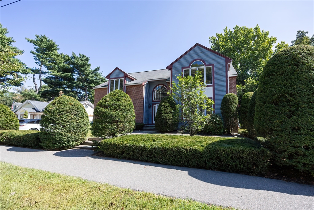 290 Central Avenue Milton, MA 02186 - Photo 2 of 40 a front view of a house with a yard