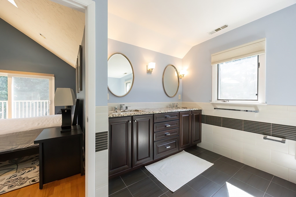 290 Central Avenue Milton, MA 02186 - Photo 26 of 40 a view of a double vanity sink mirror and window