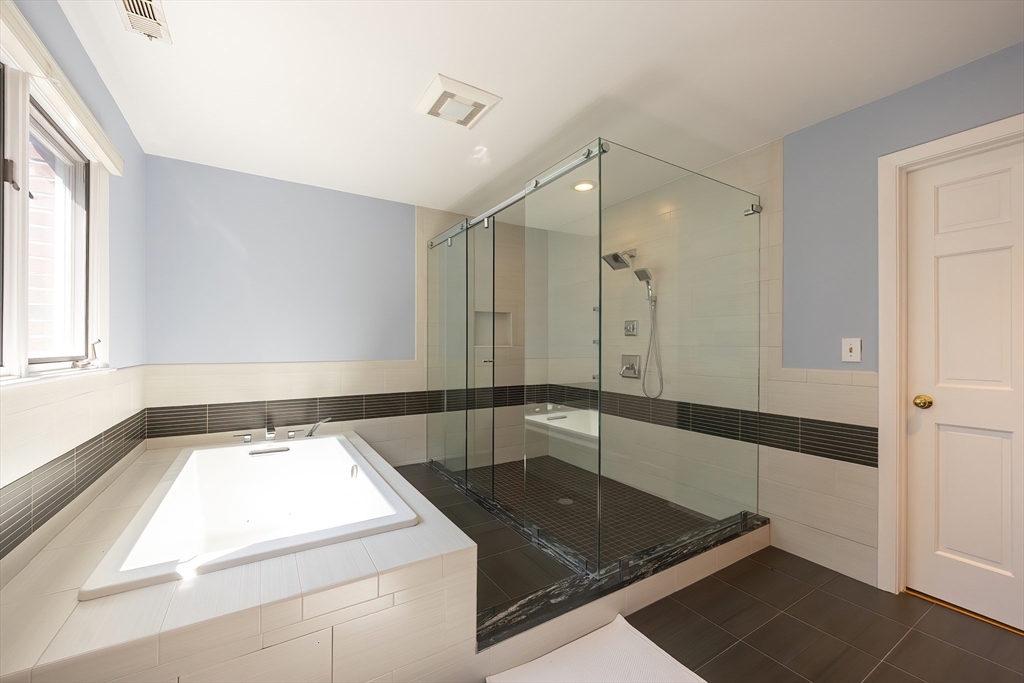 290 Central Avenue Milton, MA 02186 - Photo 27 of 40 a bathroom with a tub sink and mirror