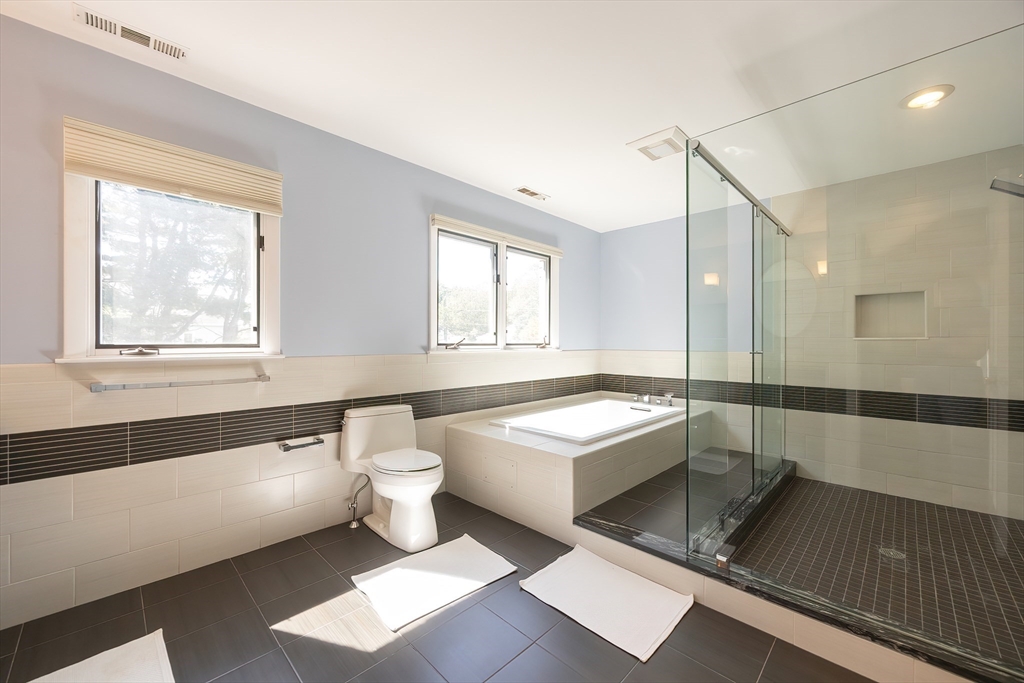 290 Central Avenue Milton, MA 02186 - Photo 28 of 40 a bathroom with a bathtub shower sink and toilet