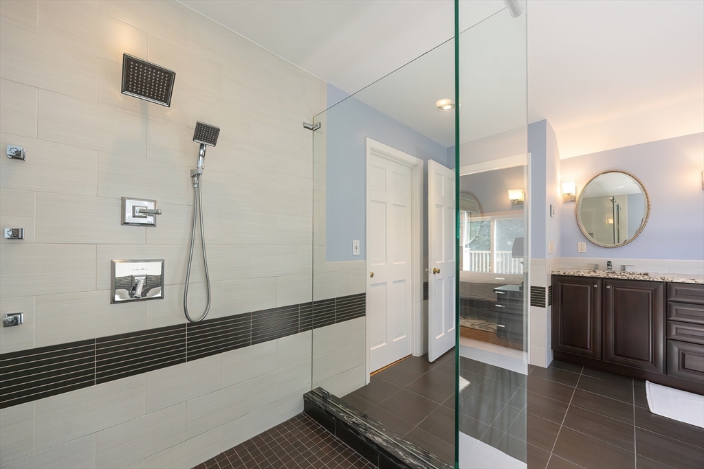 290 Central Avenue Milton, MA 02186 - Photo 29 of 40 a view of a bathroom with a tub and shower