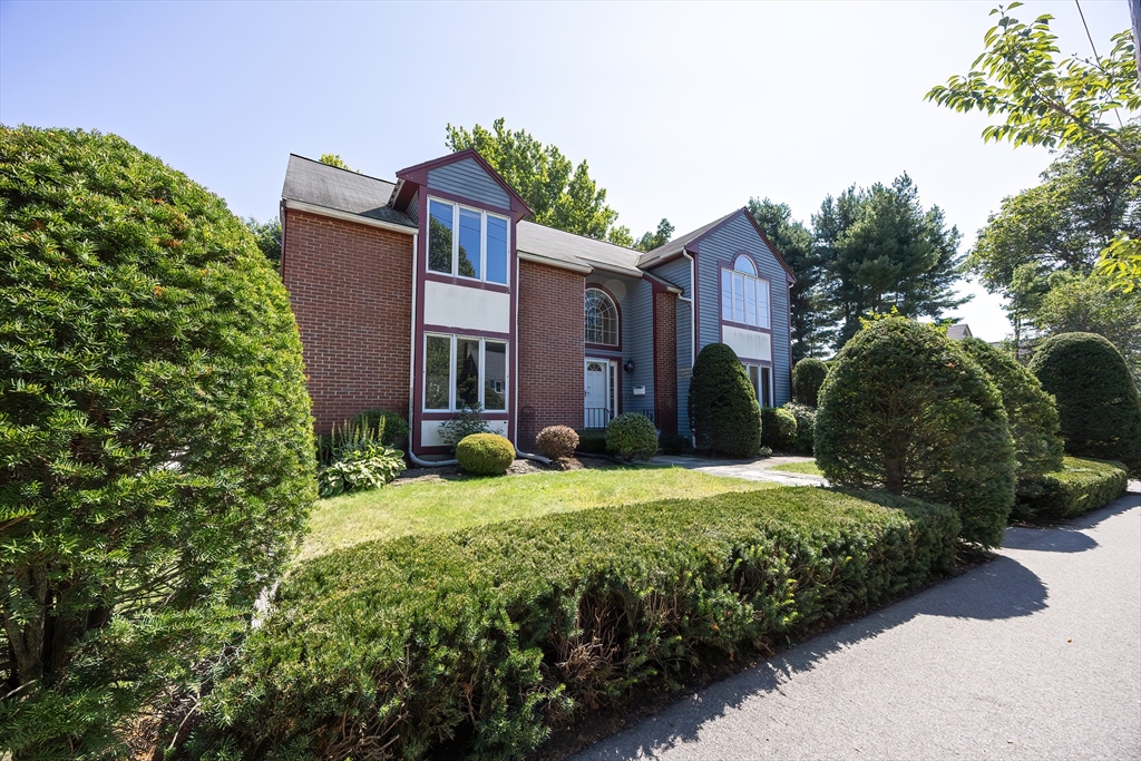 290 Central Avenue Milton, MA 02186 - Photo 3 of 40 a front view of a house with a yard