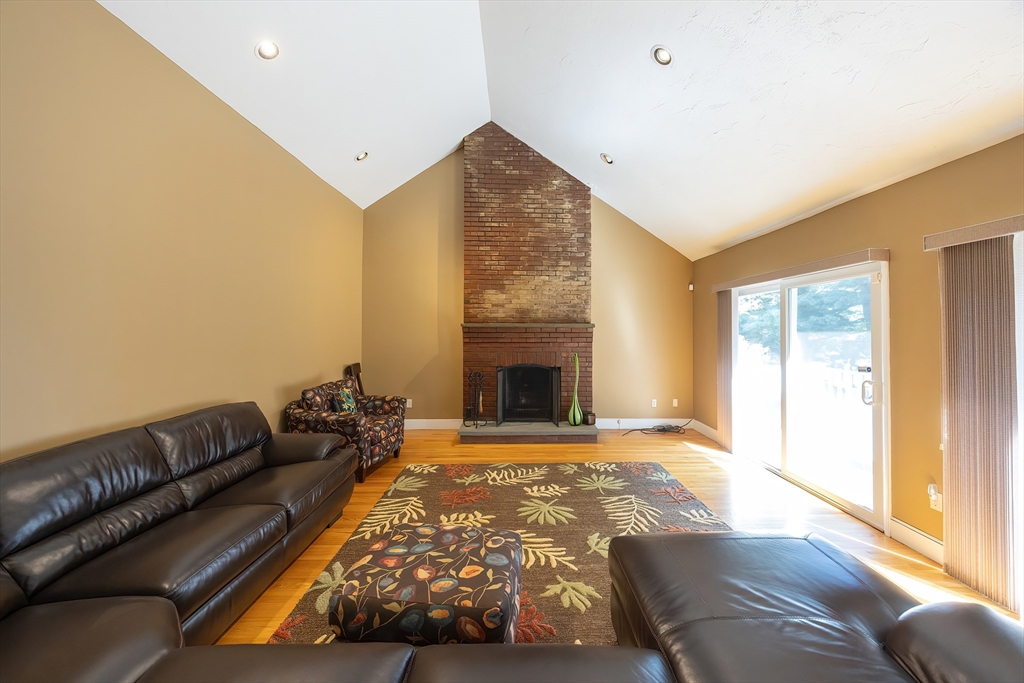 290 Central Avenue Milton, MA 02186 - Photo 6 of 40 a living room with furniture and a fireplace
