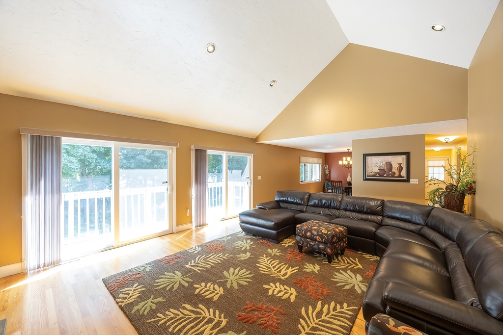 290 Central Avenue Milton, MA 02186 - Photo 7 of 40 a large bedroom with a bed and glass window