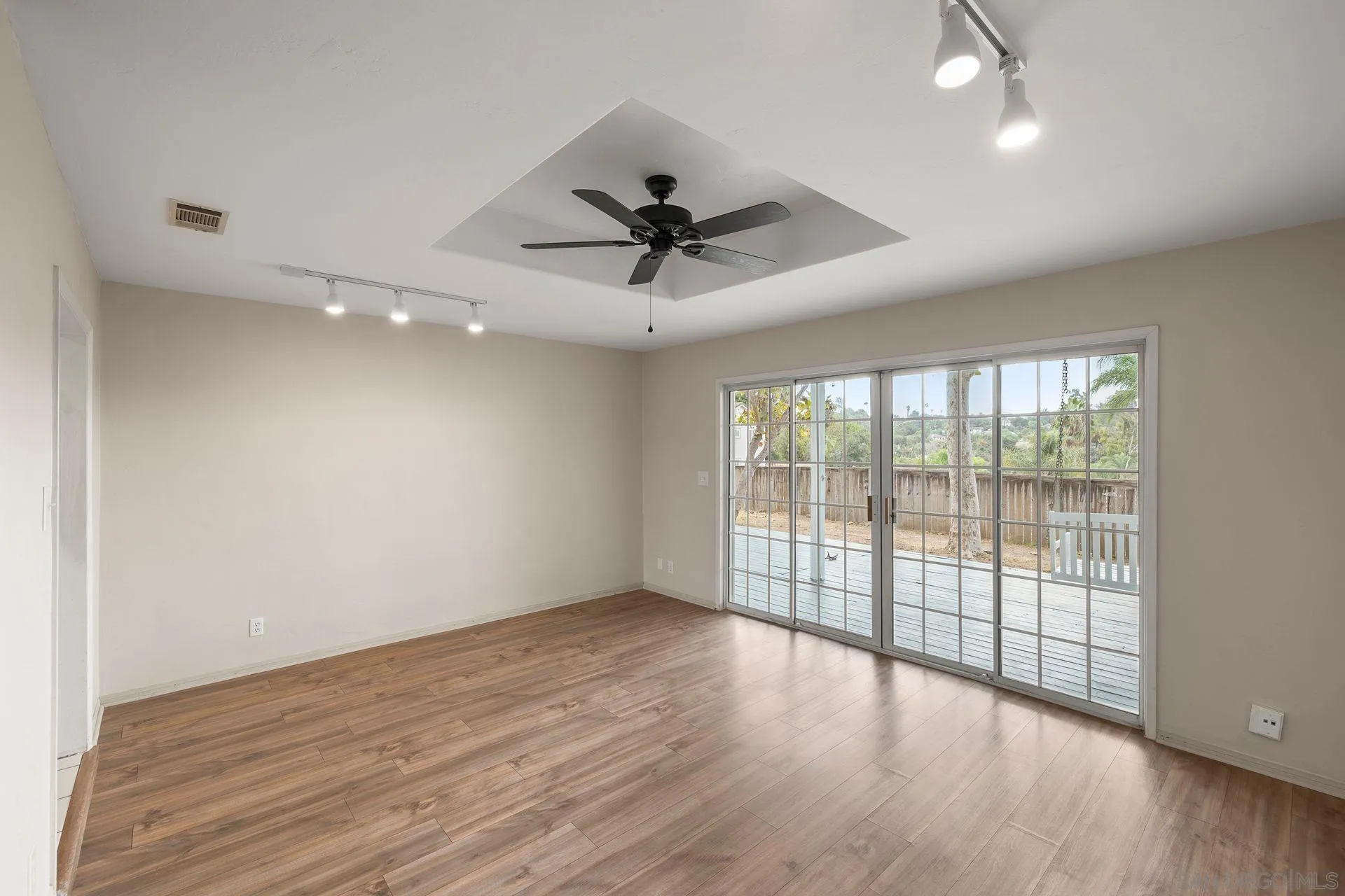 960 Sunset Drive Vista, CA 92081 - Photo 14 of 39 wooden floor in an empty room with a window