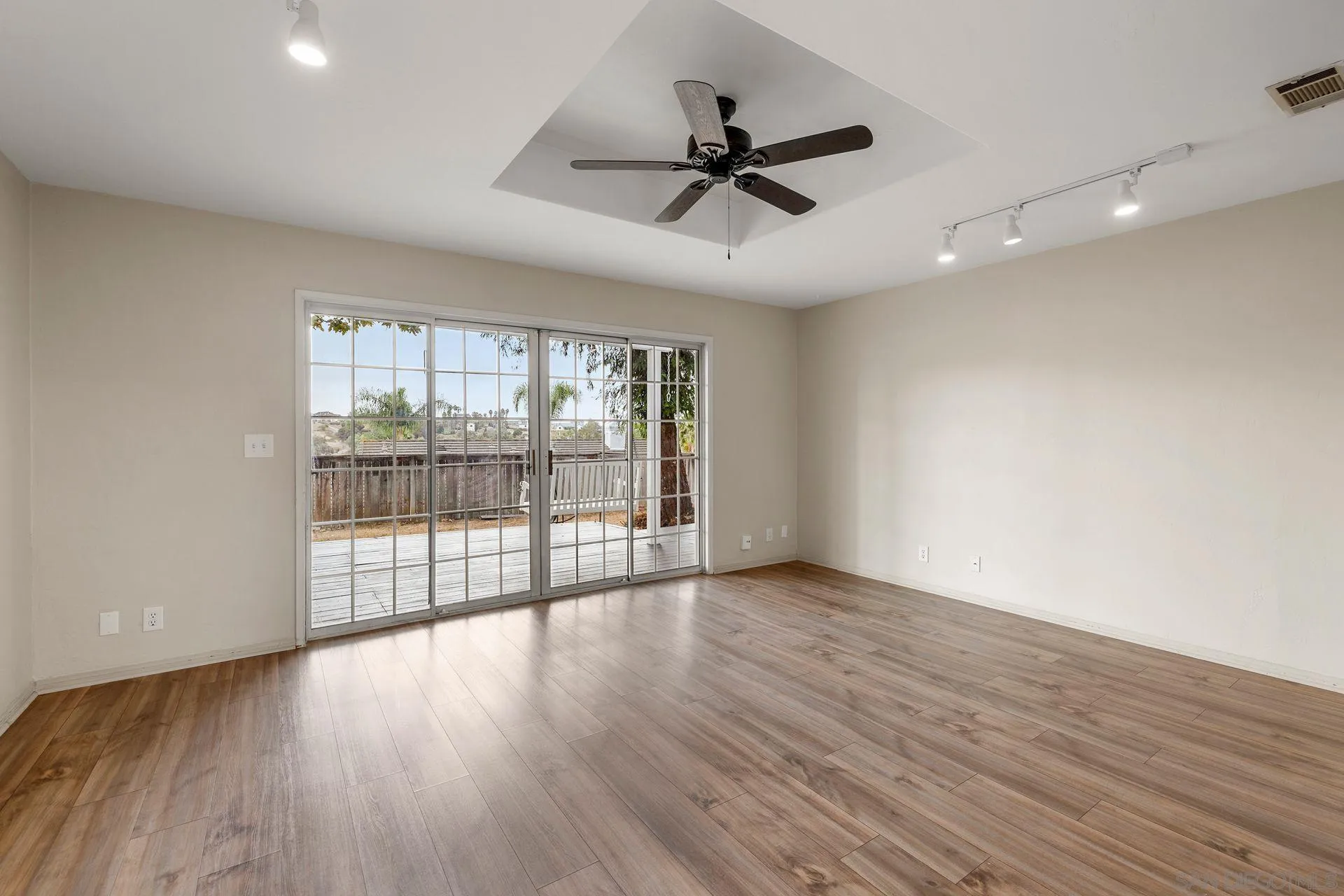 960 Sunset Drive Vista, CA 92081 - Photo 15 of 39 a view of room window and wooden floor