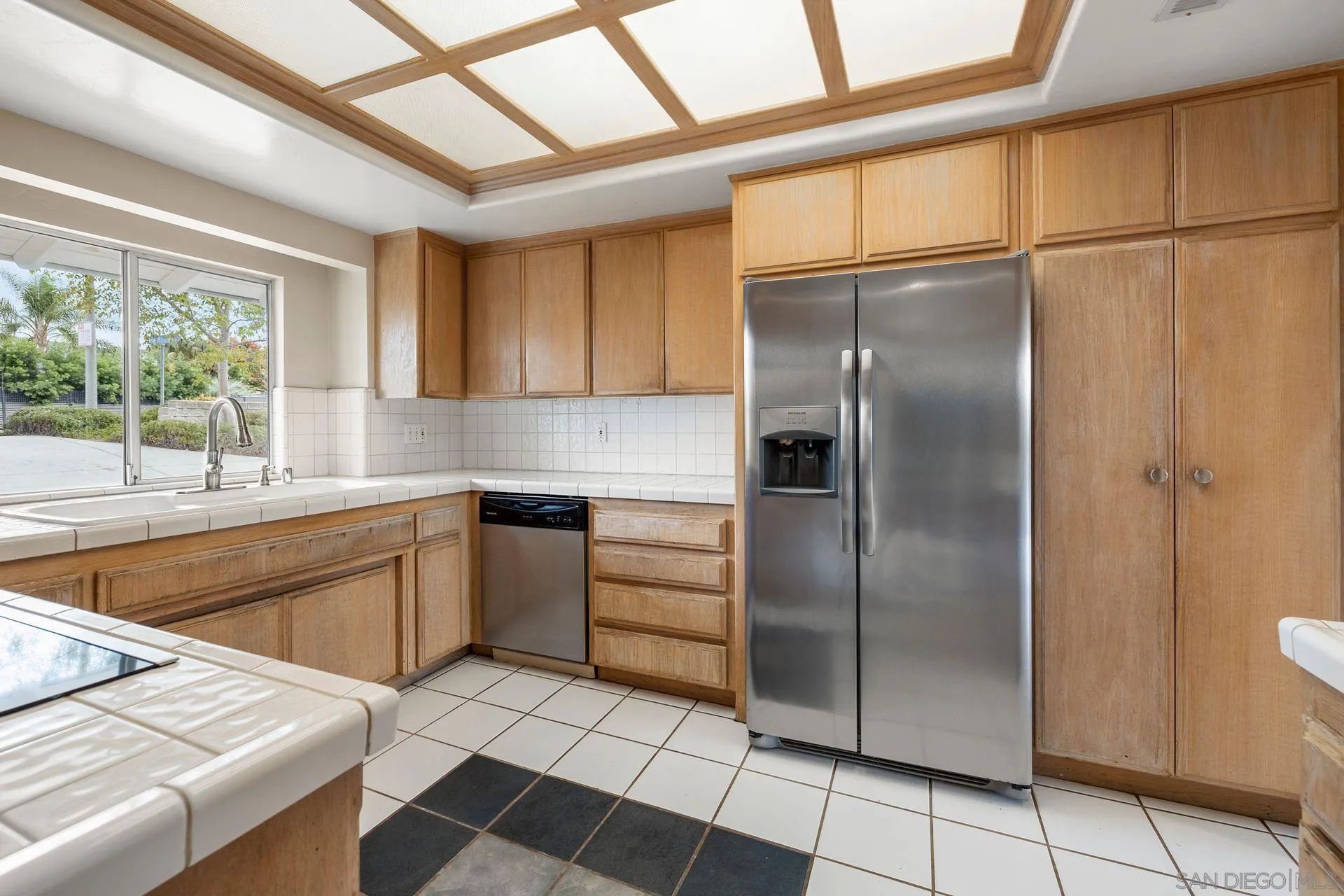 960 Sunset Drive Vista, CA 92081 - Photo 17 of 39 a kitchen with stainless steel appliances granite countertop a refrigerator and a sink