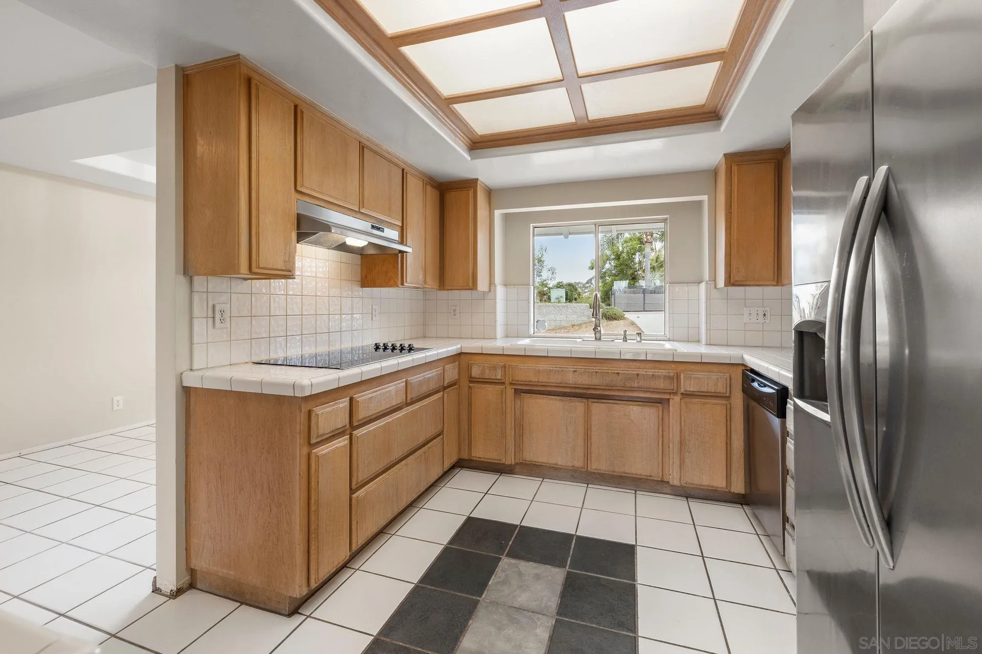 960 Sunset Drive Vista, CA 92081 - Photo 18 of 39 a kitchen with stainless steel appliances granite countertop a sink stove and refrigerator
