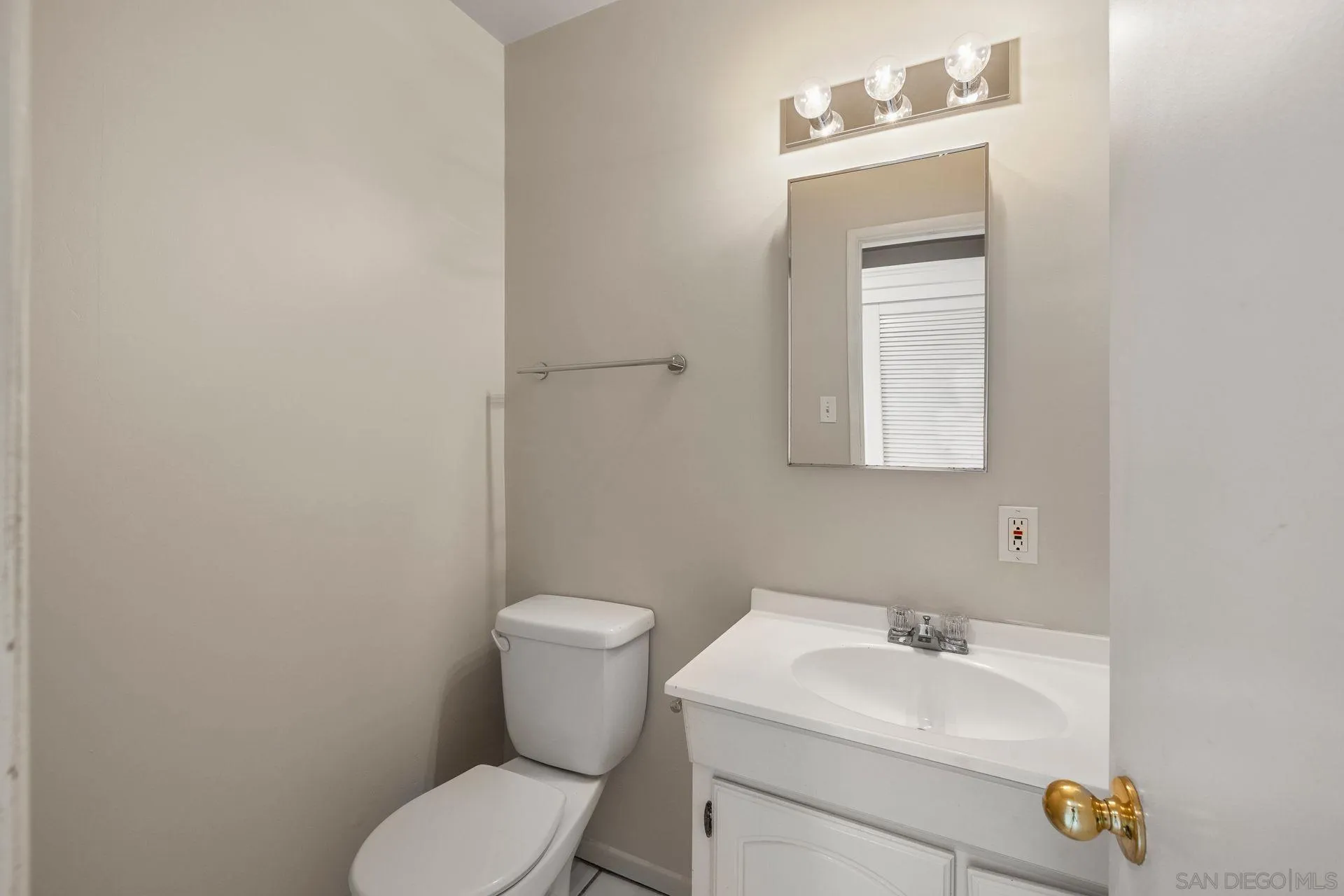 960 Sunset Drive Vista, CA 92081 - Photo 20 of 39 a bathroom with a sink toilet and vanity