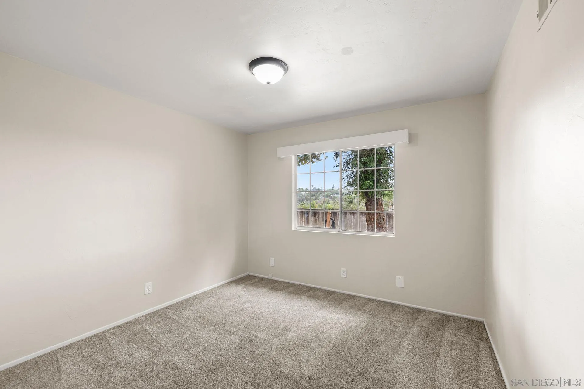 960 Sunset Drive Vista, CA 92081 - Photo 24 of 39 an empty room with windows