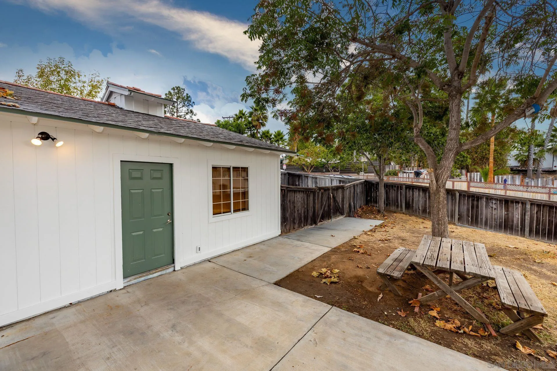 960 Sunset Drive Vista, CA 92081 - Photo 34 of 39 a view of backyard with deck and trees