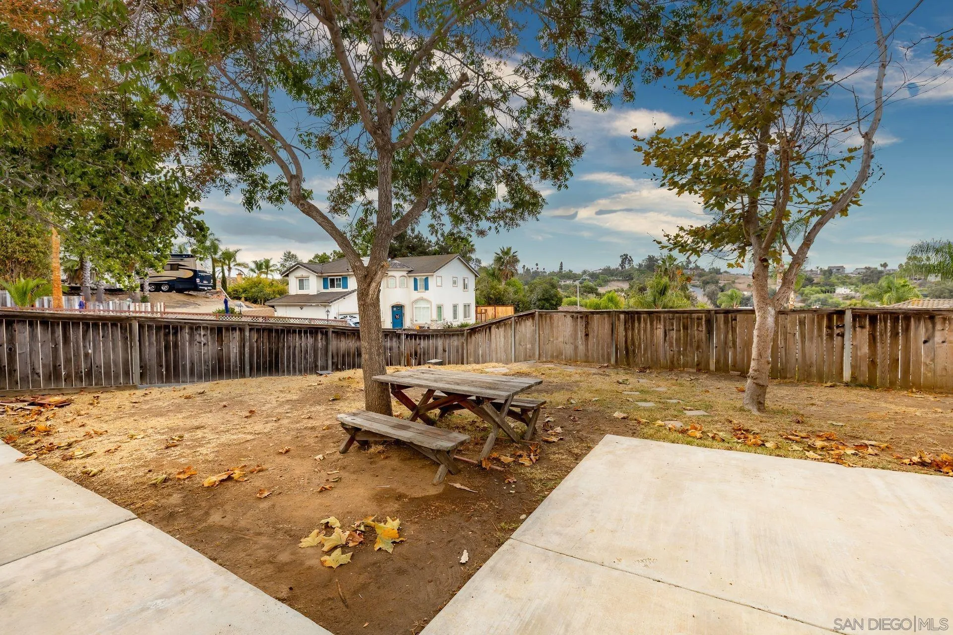 960 Sunset Drive Vista, CA 92081 - Photo 35 of 39 a view of a yard with wooden fence