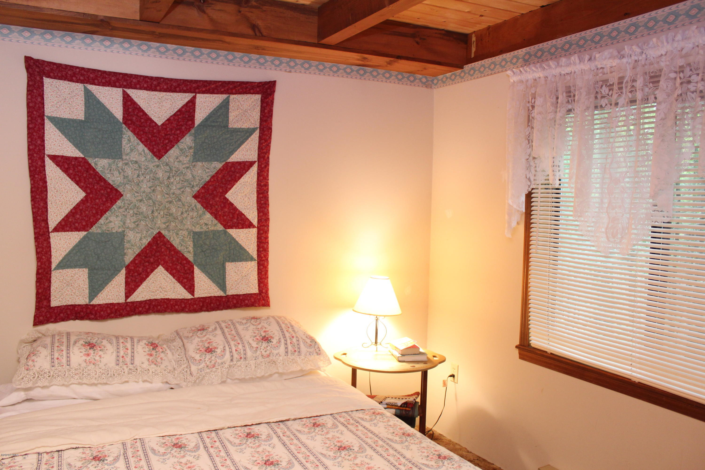 382 Northgate Road Lake Ariel, PA 18436 - Photo 8 of 20 a view of a bedroom with a bed