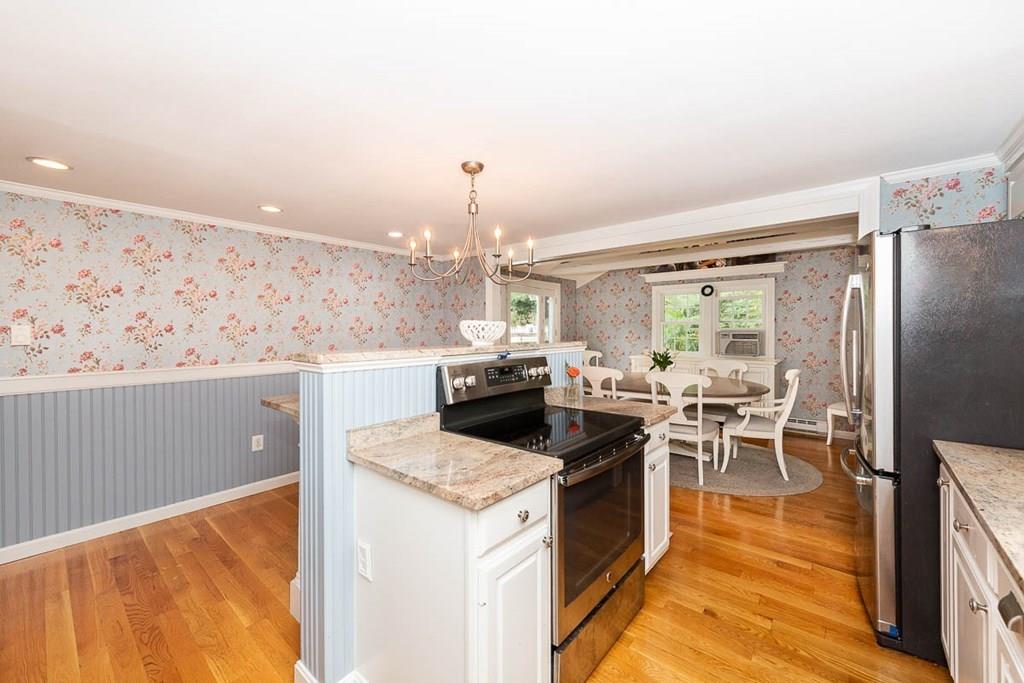 16 Boston Road Newbury, MA 01951 - Photo 11 of 30 a kitchen with a stove and a refrigerator
