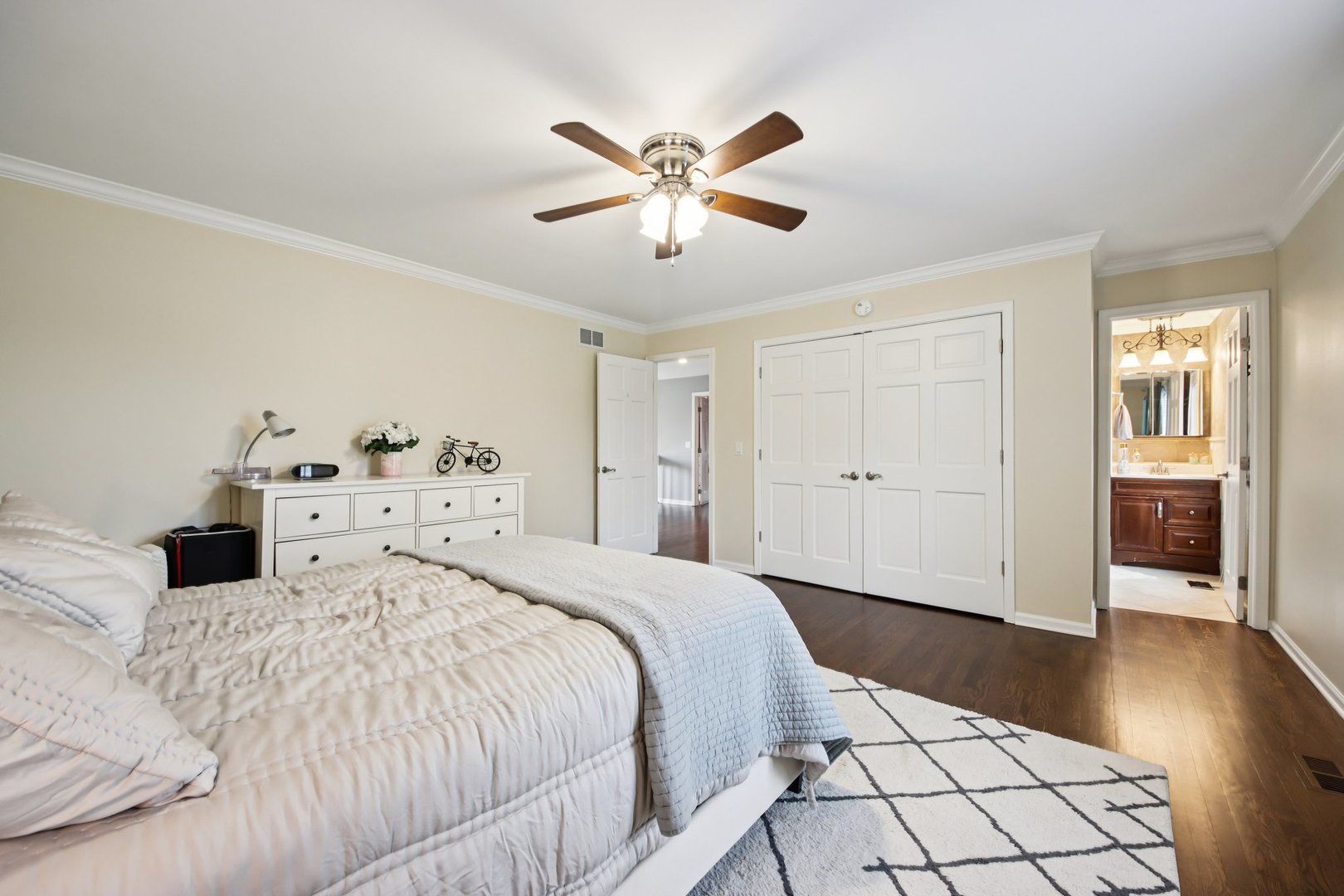 1980 West Clover Drive Inverness, IL 60067 - Photo 43 of 91 a bedroom with a large bed and a chandelier
