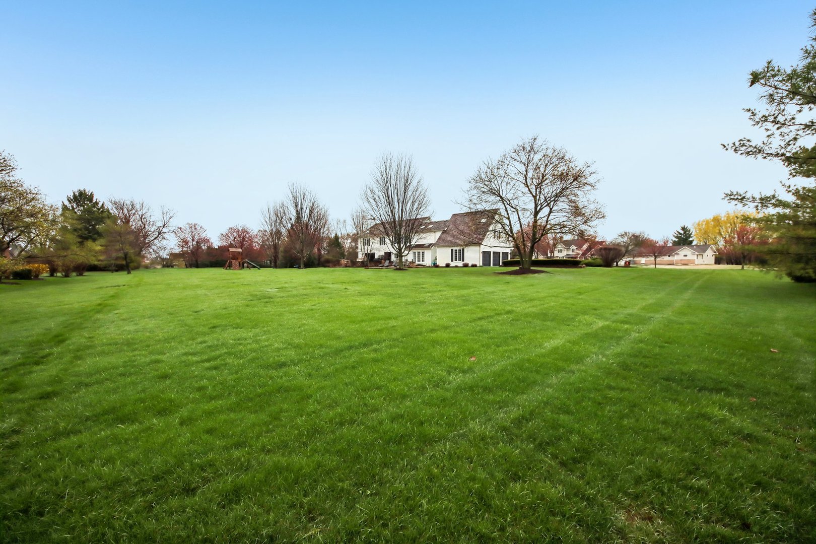 1980 West Clover Drive Inverness, IL 60067 - Photo 72 of 91 a view of a field of grass and trees