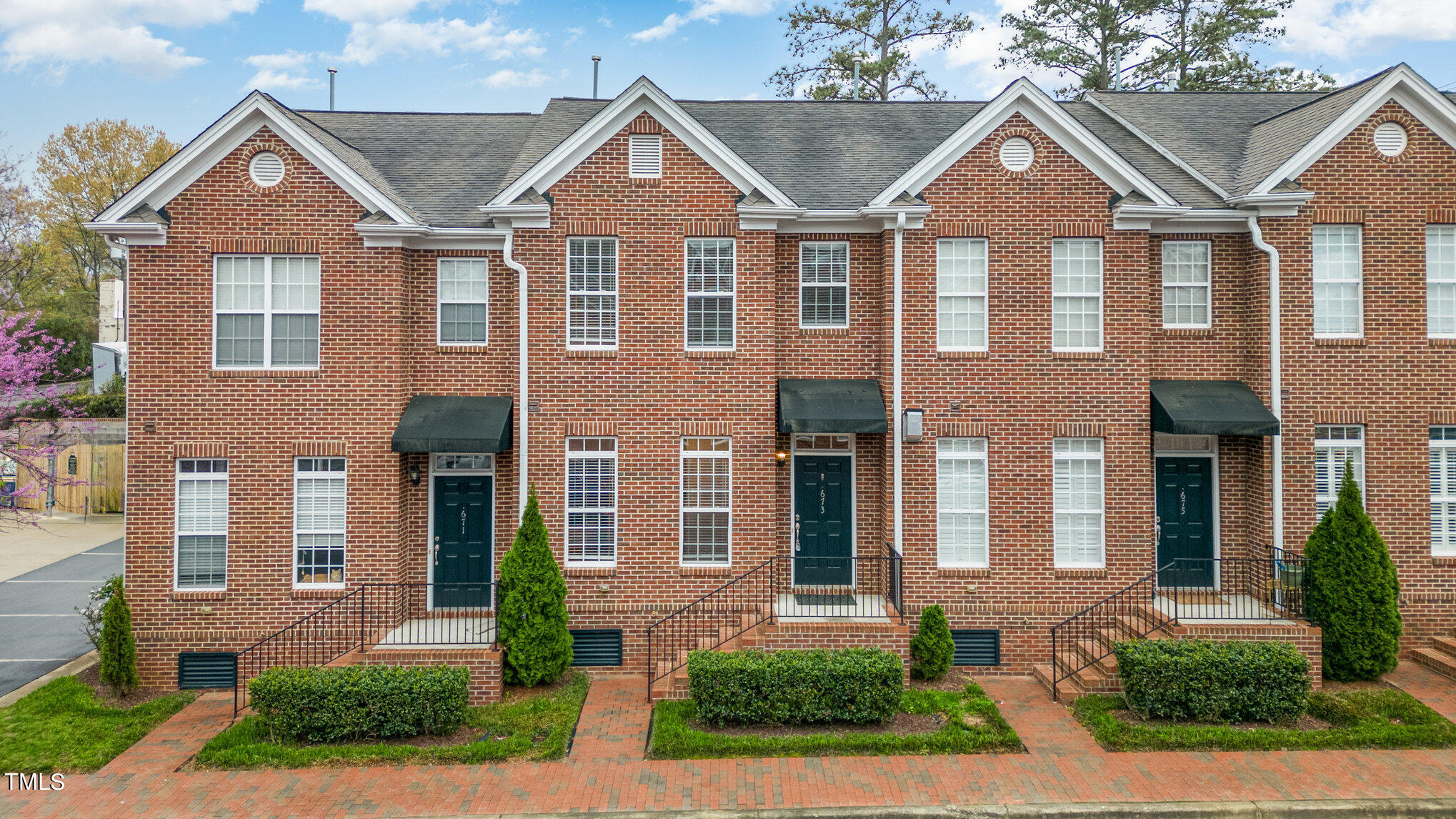 673 Highpark Lane Raleigh, NC 27608 - Photo 1 of 22 front view of a brick house with a yard