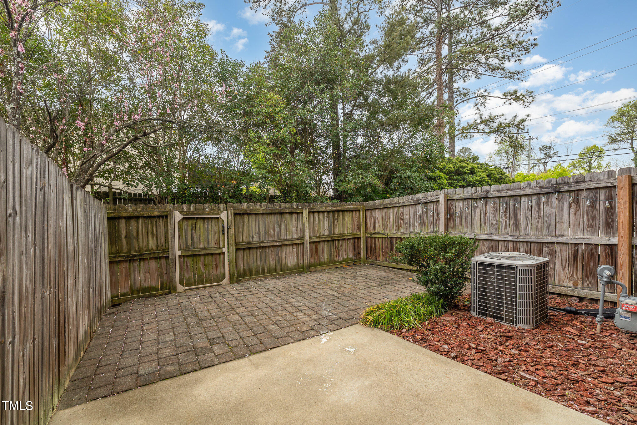 673 Highpark Lane Raleigh, NC 27608 - Photo 22 of 22 a backyard of a house with table and chairs