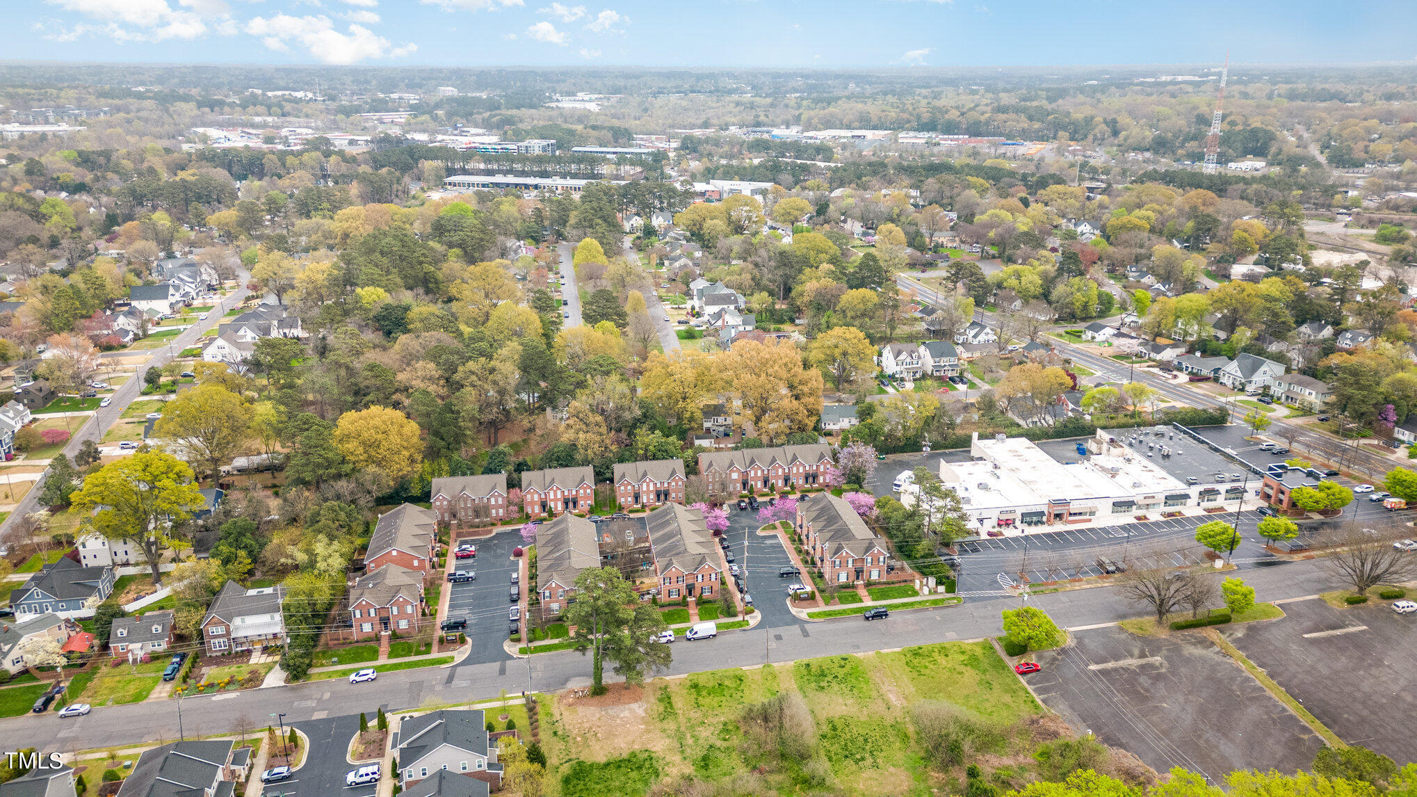 673 Highpark Lane Raleigh, NC 27608 - Photo 4 of 22 an aerial view of residential houses with outdoor space