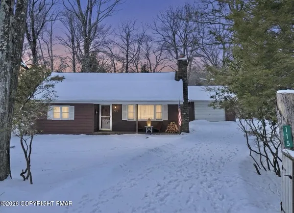 a backyard of a house with seating space