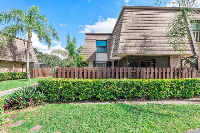 a view of a house with a yard and plants