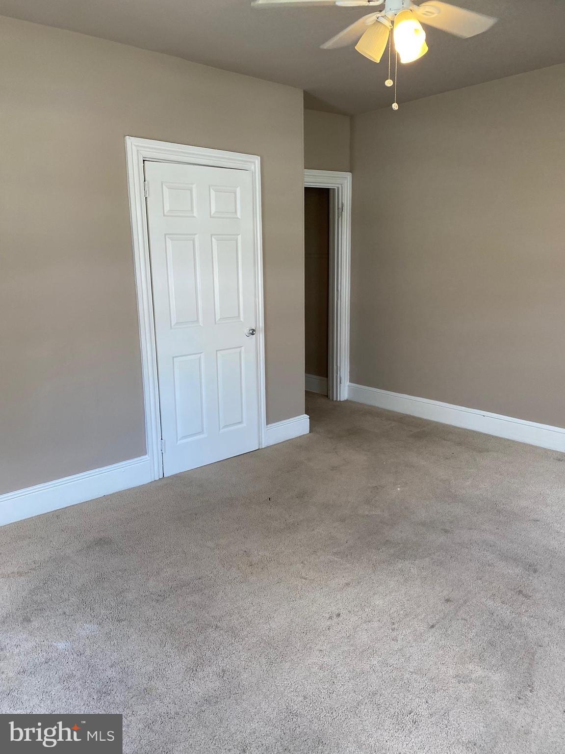 14 B Walnut Street Salem, NJ 08079 - Photo 4 of 14 an empty room with fan and entrance