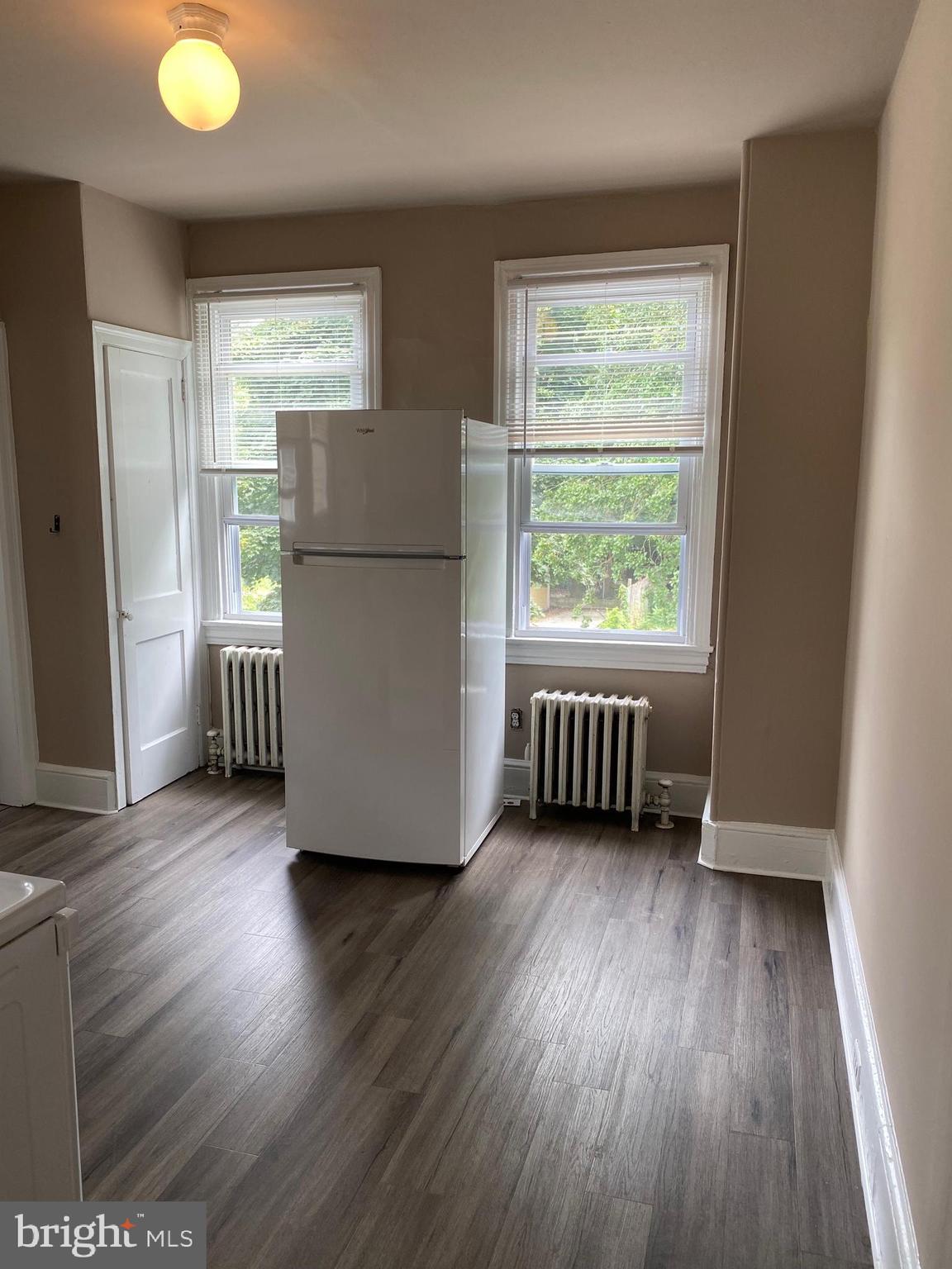 14 B Walnut Street Salem, NJ 08079 - Photo 7 of 14 a view of an empty room with wooden floor and a window