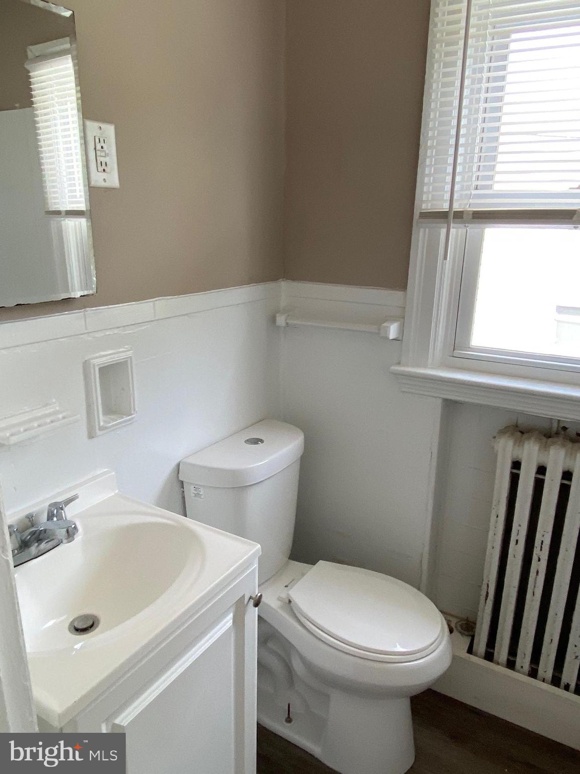 14 B Walnut Street Salem, NJ 08079 - Photo 8 of 14 a bathroom with a sink and a toilet