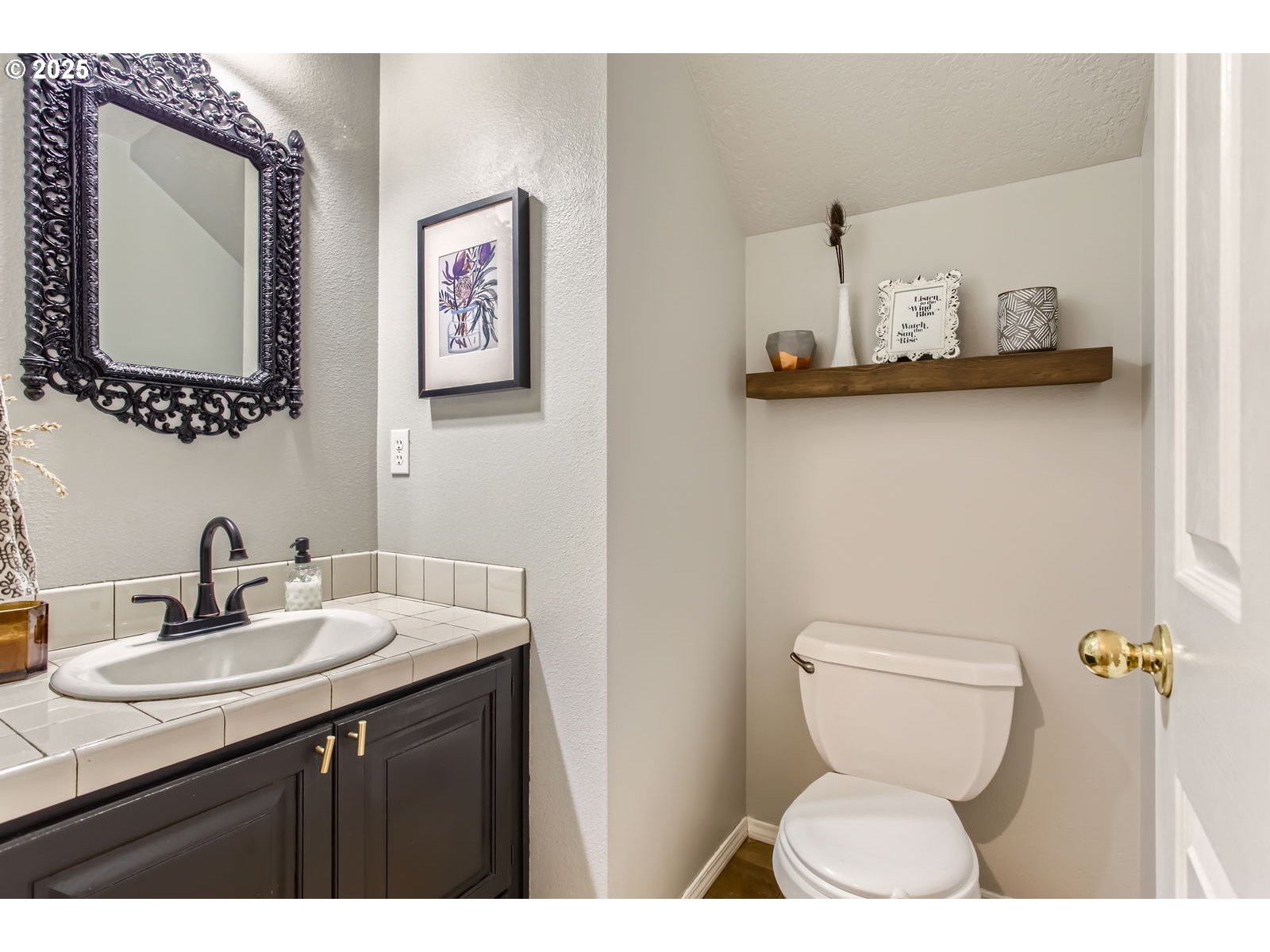 37425 Dubarko Road Sandy, OR 97055 - Photo 13 of 32 a bathroom with a toilet sink and mirror