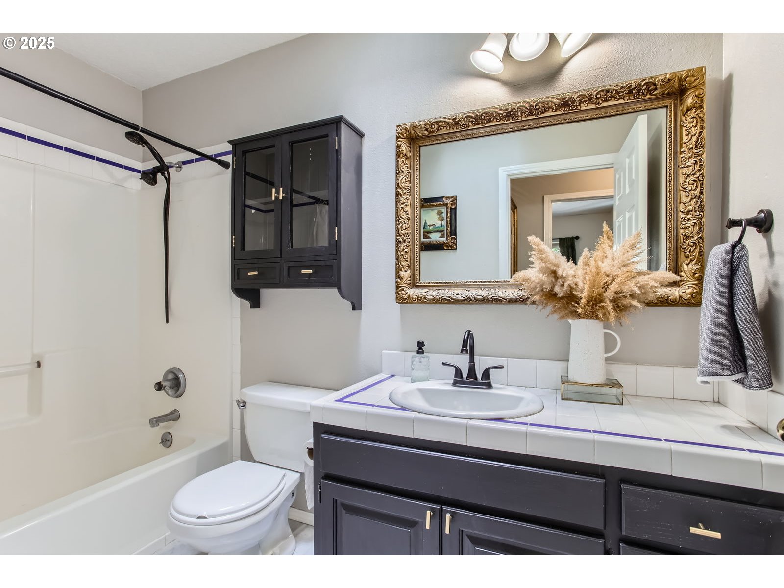 37425 Dubarko Road Sandy, OR 97055 - Photo 21 of 32 a bathroom with a sink a toilet and shower