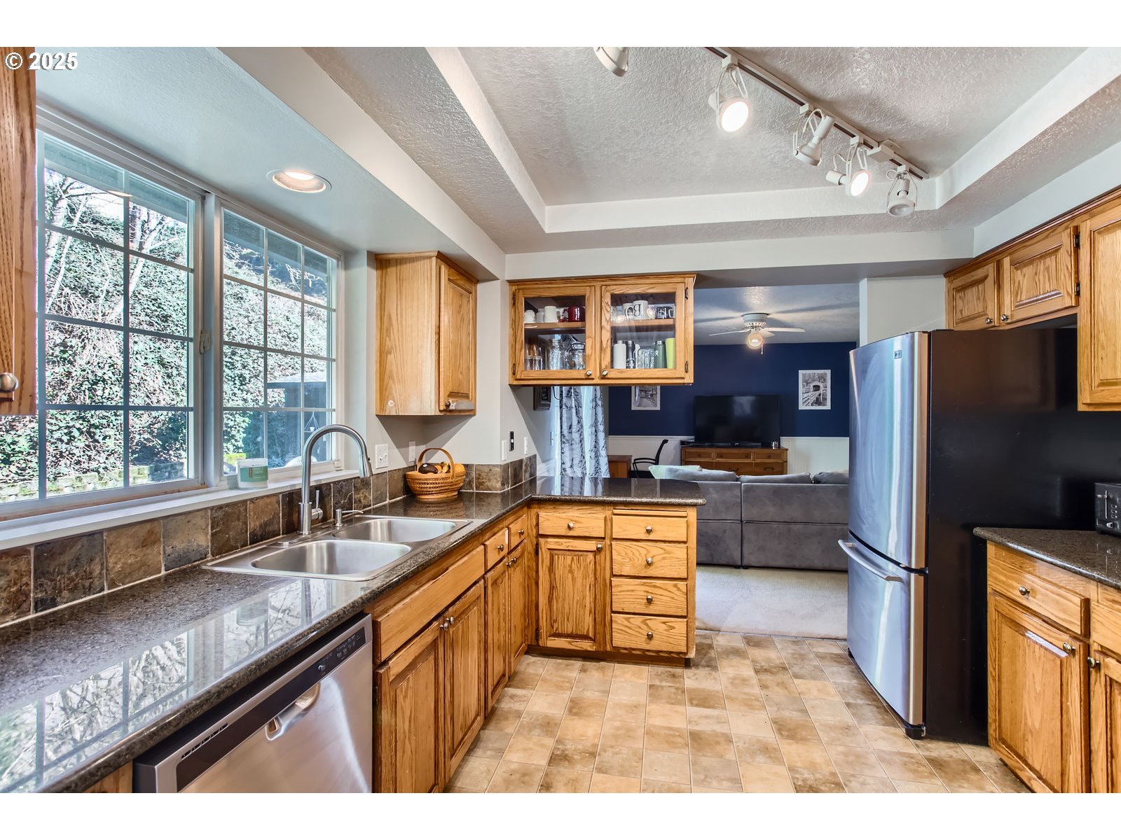 37425 Dubarko Road Sandy, OR 97055 - Photo 8 of 32 a kitchen with stainless steel appliances granite countertop a sink stove and cabinets