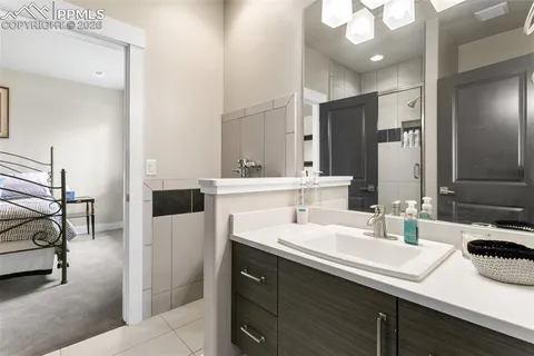 a bathroom with a sink double vanity and a mirror