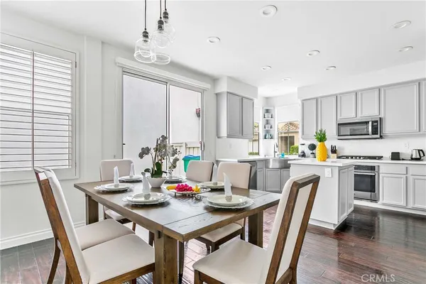 a view of a dining room with furniture window and wooden floor