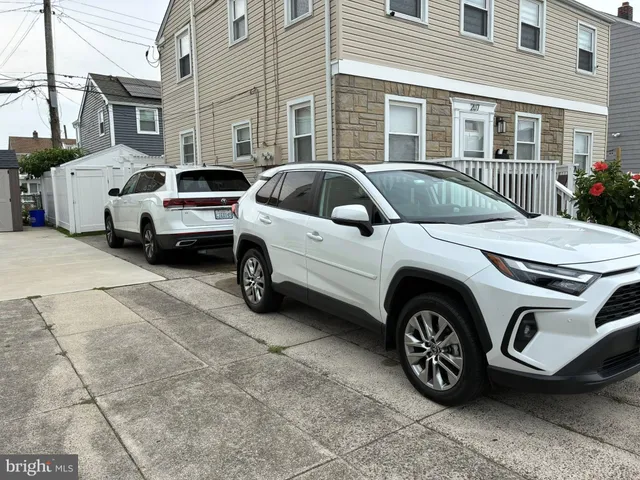 a front view of a house with parking space