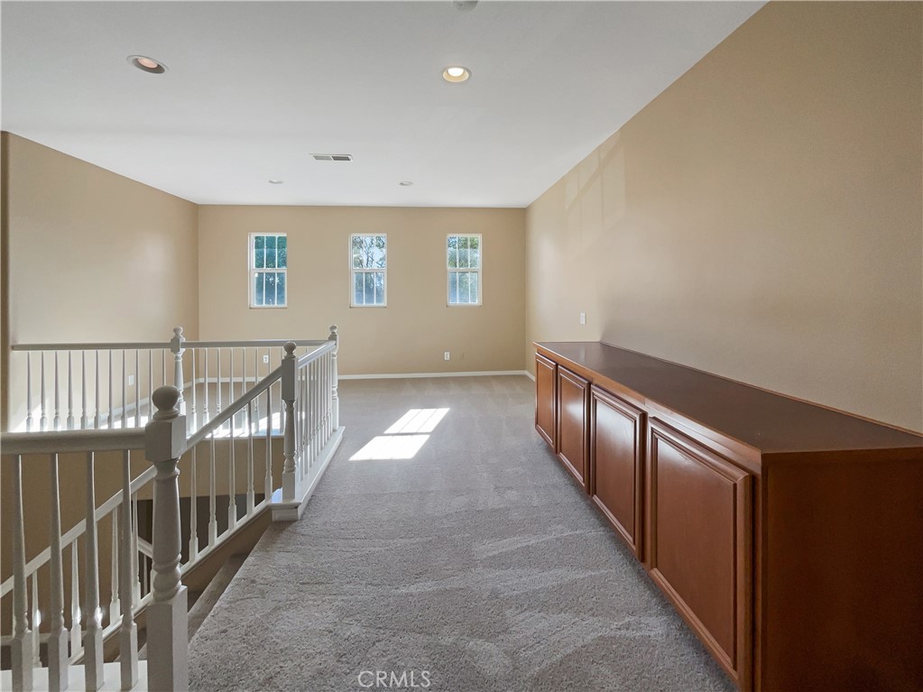 28872 Cedar Brook Lane Menifee, CA 92584 - Photo 14 of 26 a view of gallery with wooden floor