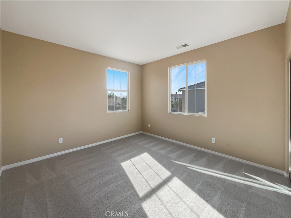 28872 Cedar Brook Lane Menifee, CA 92584 - Photo 15 of 26 an empty room with windows
