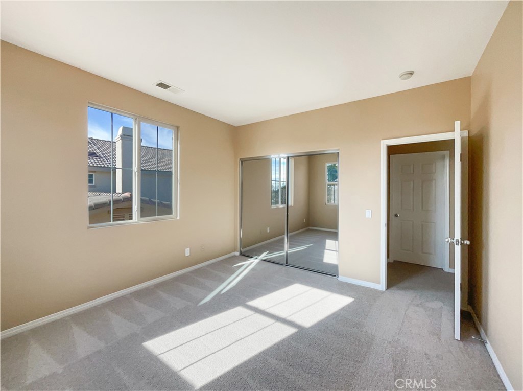 28872 Cedar Brook Lane Menifee, CA 92584 - Photo 16 of 26 a view of an empty room with glass door