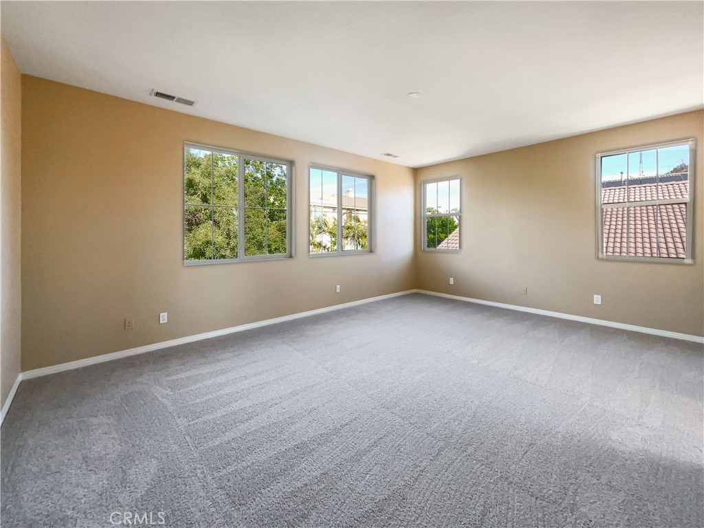 28872 Cedar Brook Lane Menifee, CA 92584 - Photo 21 of 26 an empty room with windows