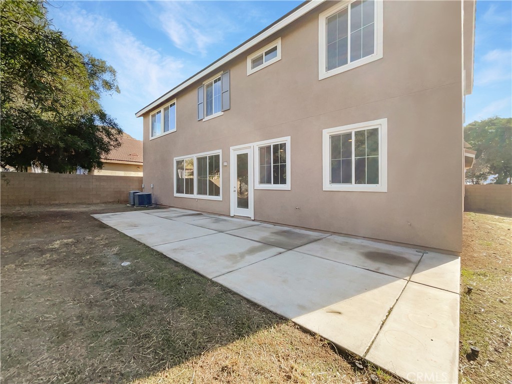 28872 Cedar Brook Lane Menifee, CA 92584 - Photo 24 of 26 a front view of a house with a yard and trees