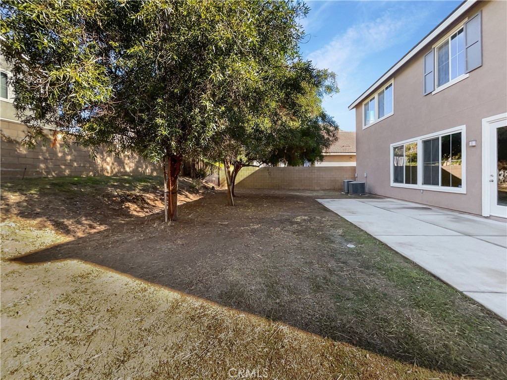 28872 Cedar Brook Lane Menifee, CA 92584 - Photo 25 of 26 a view of a yard with a house