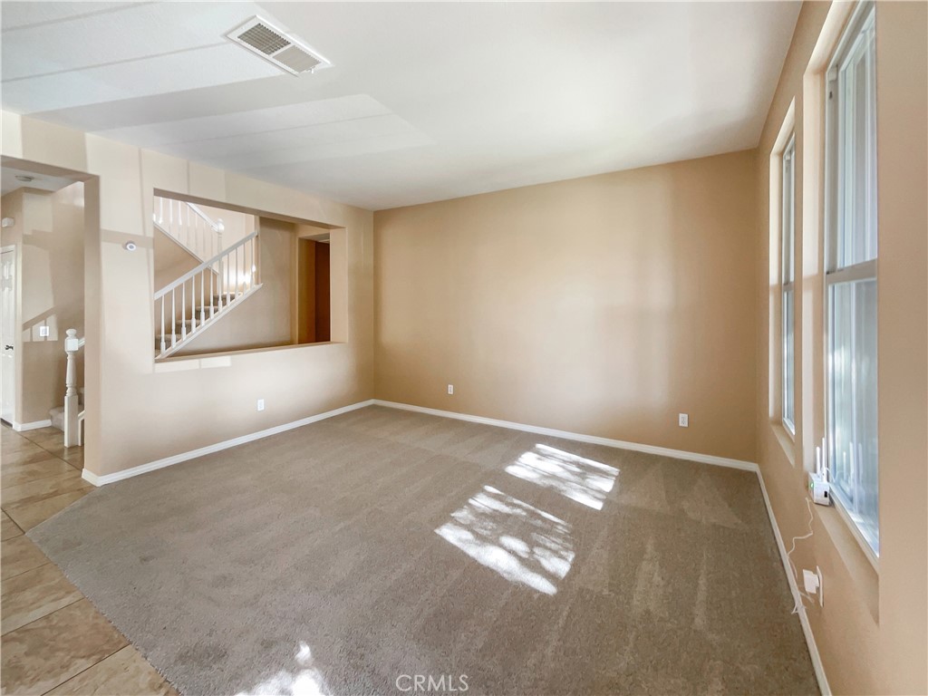 28872 Cedar Brook Lane Menifee, CA 92584 - Photo 3 of 26 a view of an empty room and window