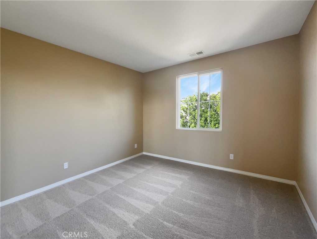 28872 Cedar Brook Lane Menifee, CA 92584 - Photo 5 of 26 an empty room with window