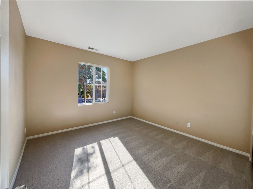 28872 Cedar Brook Lane Menifee, CA 92584 - Photo 7 of 26 an empty room with windows