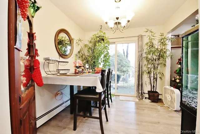 a view of a dining room with furniture and a large window